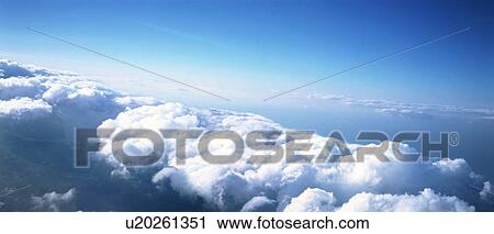 Stock Image - High-up clouds and a blue sky. Fotosearch