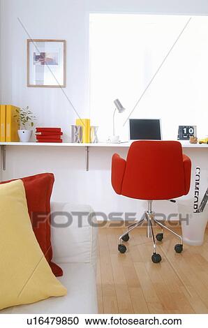 Stock Image - Home office with red chair. Fotosearch