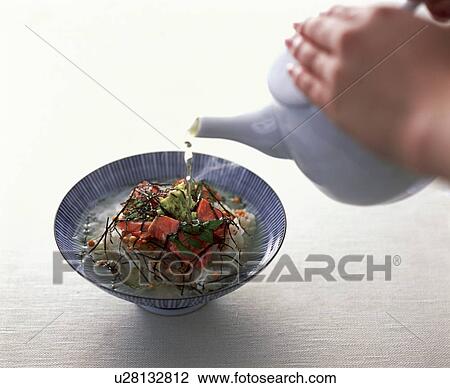 Hot water being poured onto rice dish View Large Photo Image Stock Image - Hot water being poured onto rice dish. Fotosearch
