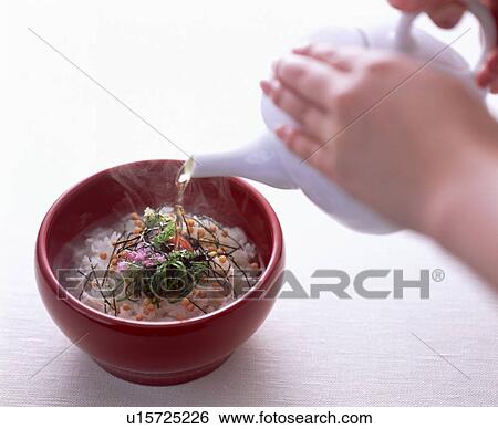 Hot water being poured onto rice dish View Large Photo Image Stock Photograph - Hot water being poured onto rice dish. Fotosearch