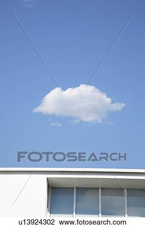 Stock Image - House and sky, Ota ward, Tokyo Prefecture, Honshu, Japan. Fotosearch