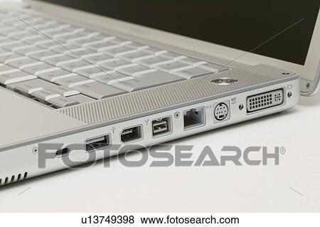 Stock Photo - Input plugs on a laptop. Fotosearch