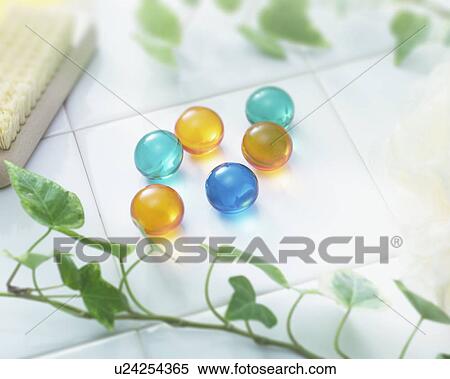 Ivy and bath beads on tile, close up View Large Photo Image Stock Photography - Ivy and bath beads on tile, close up. Fotosearch