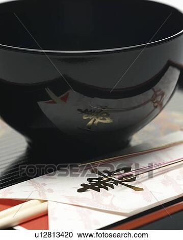 Japanese black bowl and chopsticks, close up View Large Photo Image Stock Image - Japanese black bowl and chopsticks, close up. Fotosearch