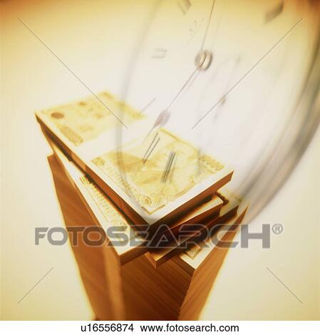 Picture - Japanese paper currency and clock. Fotosearch