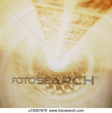 Stock Photo - Japanese paper currency going down the drain. Fotosearch
