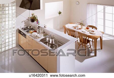 Stock Image - Kitchen and dining area. Fotosearch