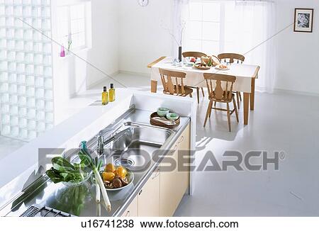 Stock Photo - Kitchen counter and dining table. Fotosearch