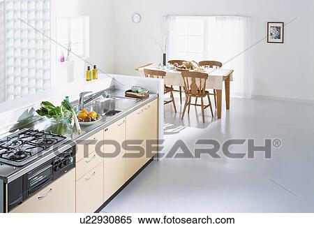 Stock Photography - Kitchen counter and dining table. Fotosearch