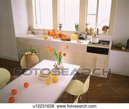 Stock Photo - Kitchen with orange theme. Fotosearch