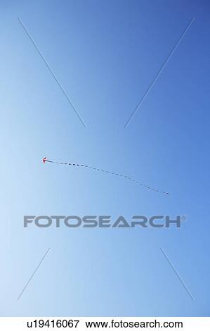 Kite in blue sky, blue background, copy space View Large Photo Image Stock Photo - Kite in blue sky, blue background, copy space. Fotosearch