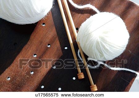 Knitting needles and ball of white yarn View Large Photo Image Stock Photography - Knitting needles and ball of white yarn. Fotosearch
