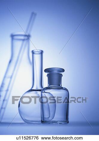Stock Photograph - Laboratory equipments, blue background, toned image. Fotosearch
