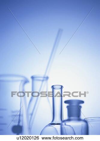 Stock Photograph - Laboratory equipments, blue background, toned image. Fotosearch
