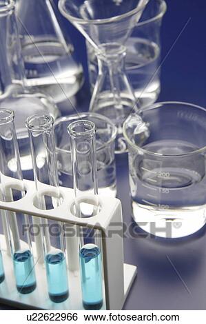 Stock Photograph - Laboratory equipments, blue background. Fotosearch
