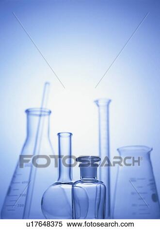 Stock Photography - Laboratory equipments, blue background, toned image. Fotosearch