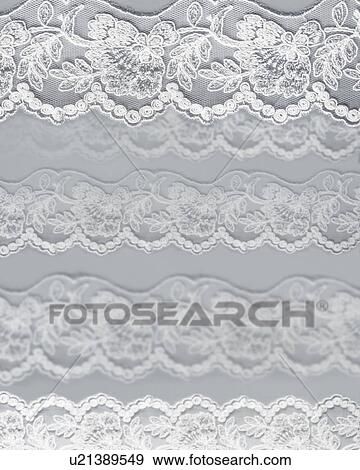 Stock Photo - Lace on a grey background. Fotosearch