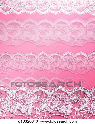 Stock Image - Lace on a pink background. Fotosearch