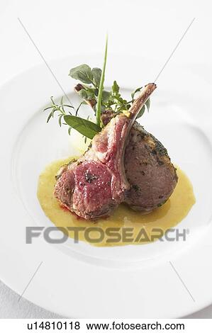 Stock Photo - Lamb chops with mustard sauce. Fotosearch