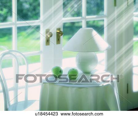 Stock Image - Lamp and apples on table, computer graphic. Fotosearch
