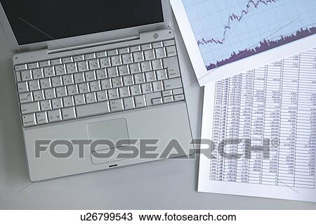 Stock Image - Laptop and documents. Fotosearch