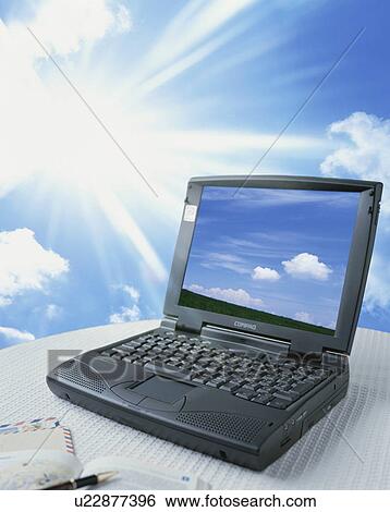 Laptop computer and sunbeams - digital composite View Large Photo Image Stock Photograph - Laptop computer and sunbeams - digital composite. Fotosearch