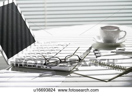 Laptop on desk View Large Photo Image Picture - Laptop on desk. Fotosearch