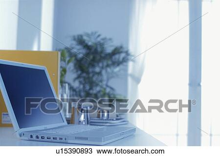 Stock Image - Laptop on office desk. Fotosearch
