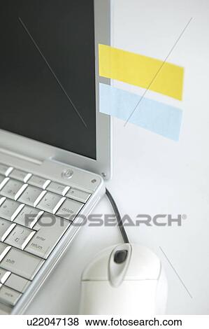 Laptop with adhesive notes, white background View Large Photo Image Stock Photo - Laptop with adhesive notes, white background. Fotosearch