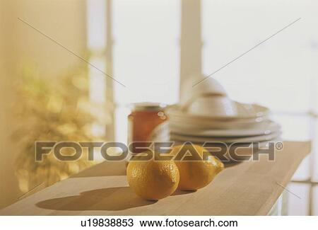 Lemons and a jar of marmalade with plates on a kitchen countertop View Large Photo Image Stock Image - Lemons and a jar of marmalade with plates on a kitchen countertop. Fotosearch