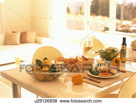 Lemons and sliced bread with meal on dining table View Large Photo Image Stock Photo - Lemons and sliced bread with meal on dining table. Fotosearch