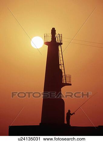 Stock Image - Lighthouse and Sunrise. Fotosearch