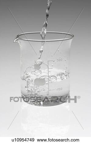 Liquid being poured into beaker View Large Photo Image Stock Photo - Liquid being poured into beaker. Fotosearch