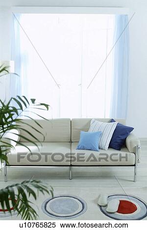 Stock Photography - Living room with beige sofa. Fotosearch