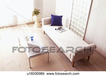 Stock Photography - Living room with chaise longue and coffee table. Fotosearch