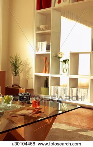 Stock Photo - Living room with shelves and coffee table. Fotosearch