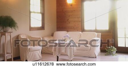 Stock Photo - Living room with sofa and coffee table. Fotosearch