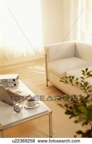 Living room with sofa and coffee table View Large Photo Image Stock Photo - Living room with sofa and coffee table. Fotosearch