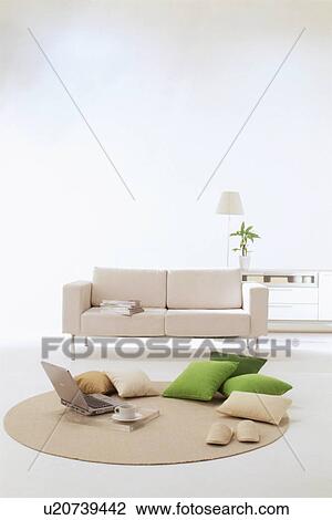 Stock Image - Living room with sofa and rug. Fotosearch