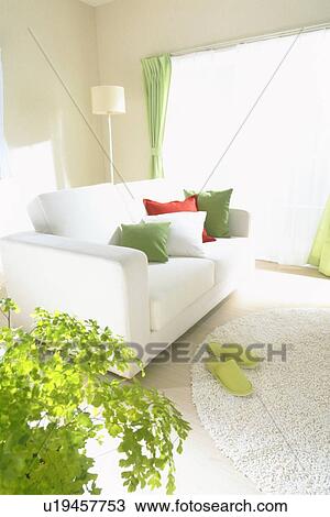Stock Image - Living room with white sofa. Fotosearch