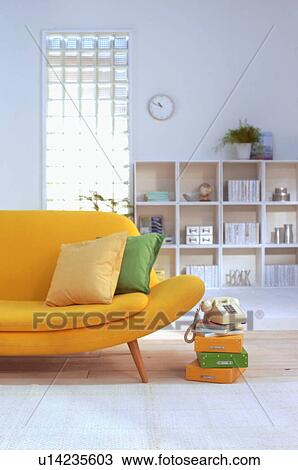 Stock Image - Living room with yellow sofa. Fotosearch