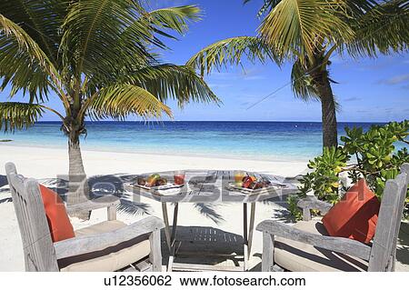 Stock Image - Lunch in the beach, Maldive Islands. Fotosearch