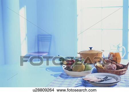 Lunch on table in blue tinted room View Large Photo Image Picture - Lunch on table in blue tinted room. Fotosearch