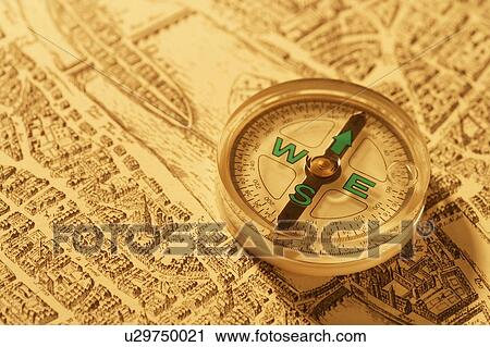 Stock Image - Map of Paris and compass. Fotosearch