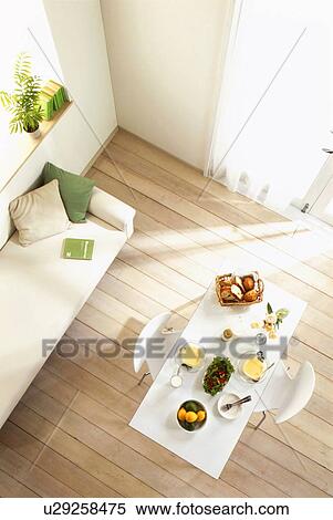 Meal on table next to sofa View Large Photo Image Stock Photography - Meal on table next to sofa. Fotosearch