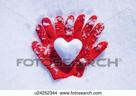 Picture - Mittens on the Snow with a Loveheart. Fotosearch