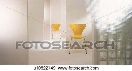 Stock Photo - Modern room with two yellow chairs. Fotosearch