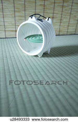 Stock Image - Mosquito coil holder in pig ceramics. Fotosearch