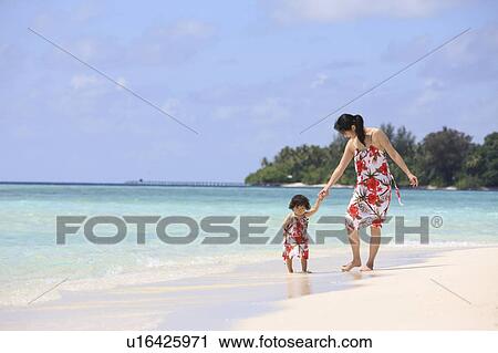 Mother and daughter at the beach, Maldive Islands View Large Photo Image Stock Image - Mother and daughter at the beach, Maldive Islands. Fotosearch