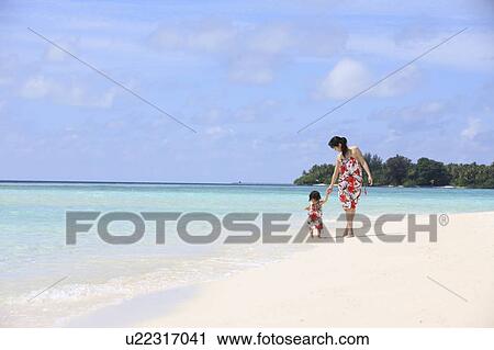 Mother and daughter at the beach, Maldive Islands View Large Photo Image Stock Image - Mother and daughter at the beach, Maldive Islands. Fotosearch